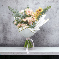 Morning Sun Delight, Cymbidium, Gerbera, Spray Rose, Rose Pink, Eucalyptus, White Wrapping