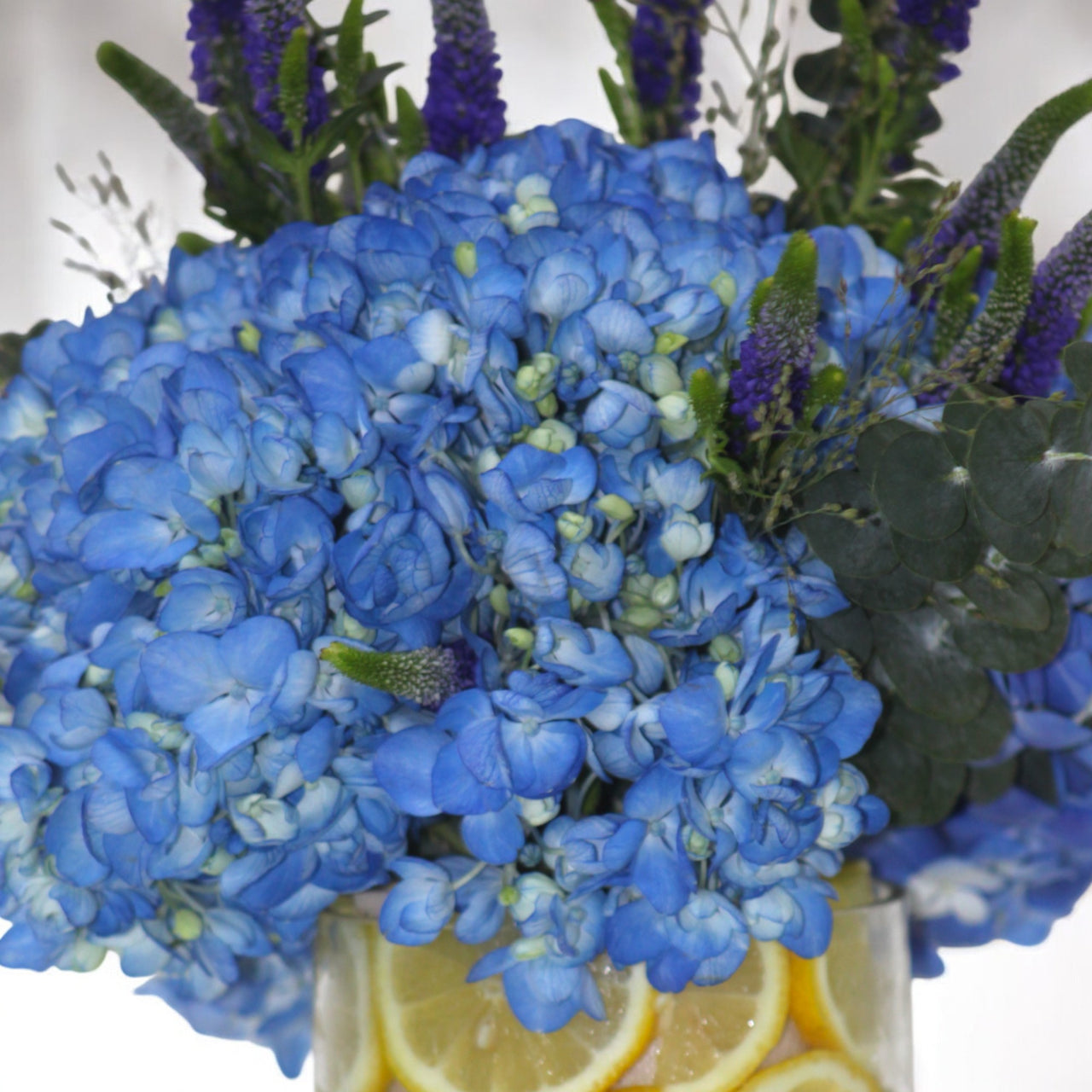 Blue Hydrangea & Veronica Arrangement with Lemon Accents
