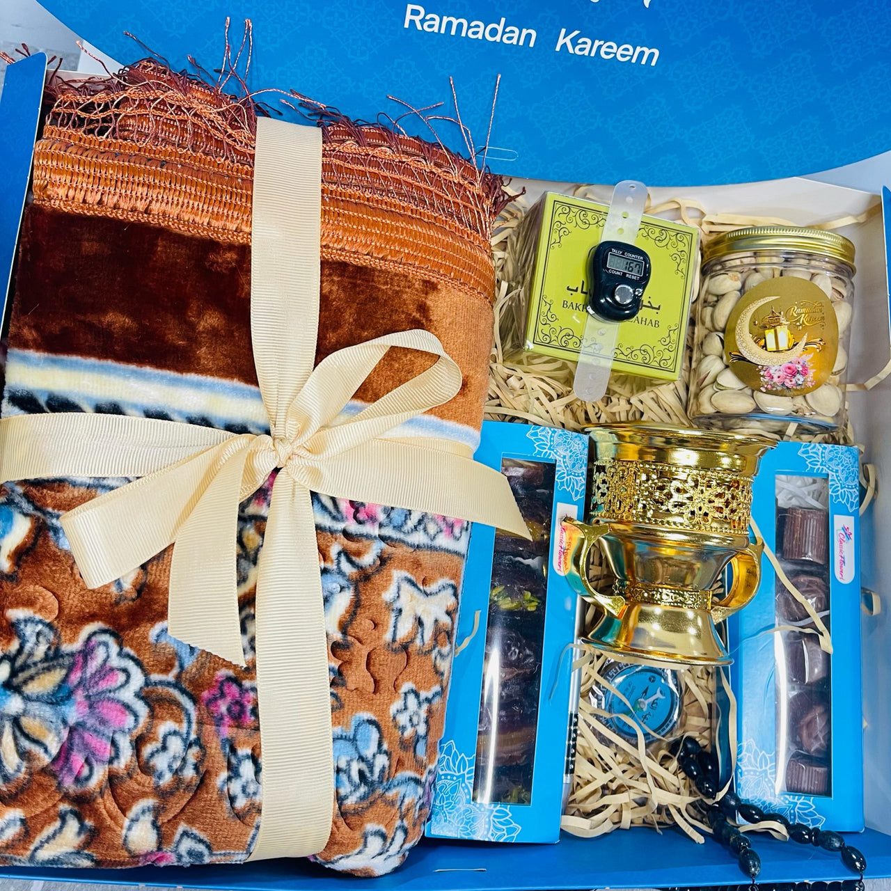 "Ramadan Kareem Gift Basket with Prayer Mat, Nuts, Dates and Bakhor"