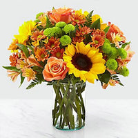 Vibrant Blooms, Stunning Floral Arrangement, Orange Roses, Sunflowers, Chrysanthemums, Alstroemeria, Green Button Chrysanthemums, Leather Fern Leaves, Glass Vase